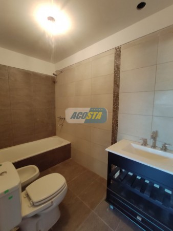EDIFICIO CON ULTIMAS UNIDADES A ESTRENAR, 2 Y 3 AMBIENTES, CON COCHERA Y TERRAZA